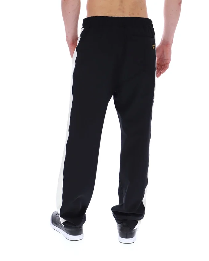 Schwarze, vom Ali-Tennis inspirierte Hose